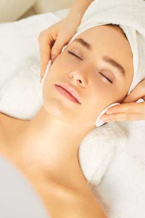 Woman enjoying a relaxing facial treatment